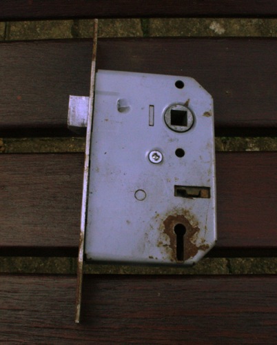 Mechanism often secured by a single screw